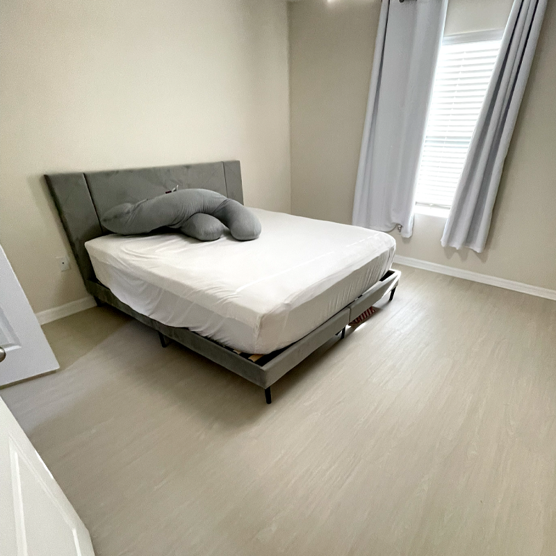 Bedroom with soft gray flooring